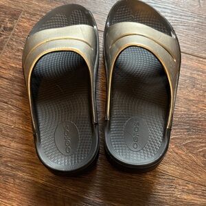 OOFOS Black and Gold Comfort Slides